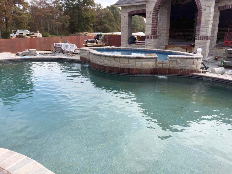 pool with fountain - JNR Pools